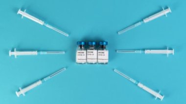 Coronavirus Covid-19 aşı tüpleri ve şırıngaları ile hareket animasyonunu durdur.