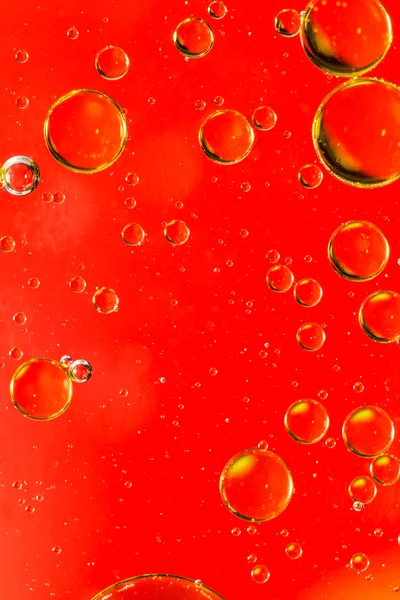 Oil and water abstract in vivid red — Stock Photo, Image