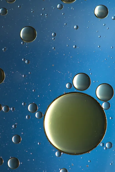 Oil and water abstract in blue, silver and gold — Stock Photo, Image