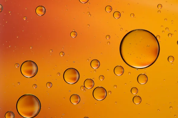 Oil and water abstract in orange — Stock Photo, Image