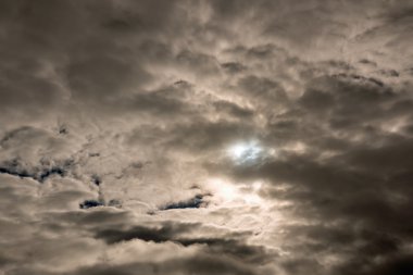 Dark foreboding sky at height of solar eclipse clipart