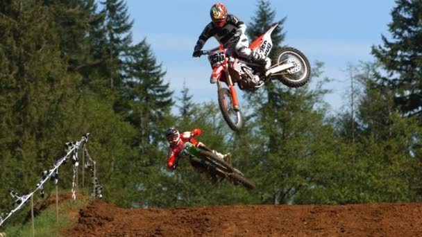 Motocross racers jumping in slow motion — Stock Video