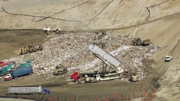 Trucks and tractors working in landfill — Stock Video