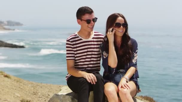 Couple sitting on rock — Stock Video