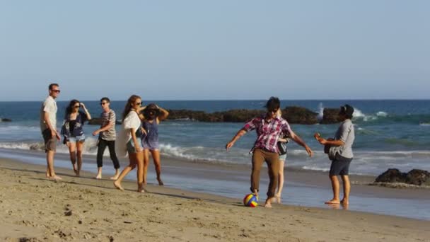 People playing ball on beach — Stock Video