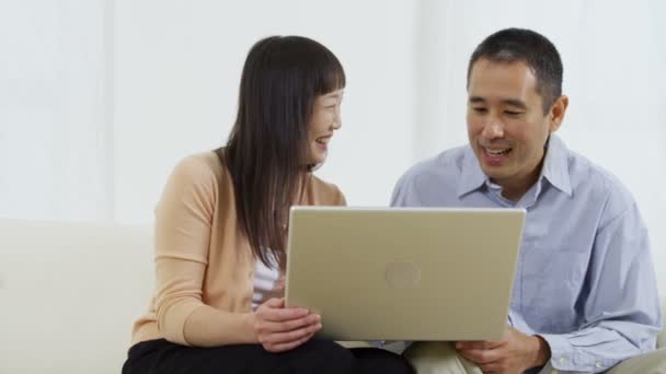 Couple with laptop computer — Stock Video