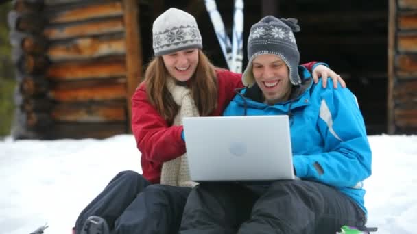 Couple using a laptop — Stock Video