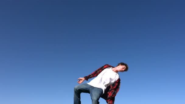 Boy flips in sky — Stock Video