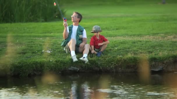 Father and son fishing — Stock Footage Father and son fishing Royalty Free Stock Video