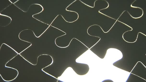 Hand placing puzzle piece — Stock Video