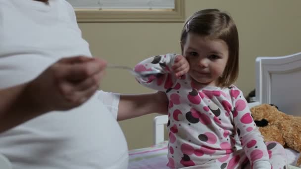 Mother gives medicine to  girl — Stock Video