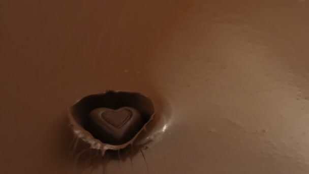 Candy splashing into chocolate — Stock Video