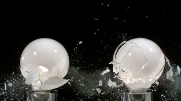 Lightbulbs hit by slingshot — Stock Video