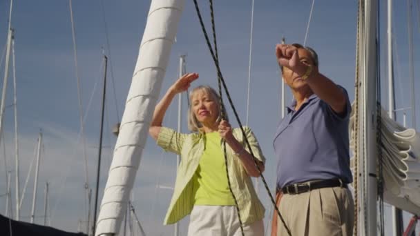 Senior couple on sailboat — Stock Video