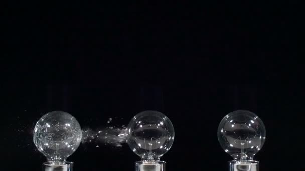Lightbulbs hit by slingshot in super slow motion. Shot with Phantom camera at 6900 frames per second. — Stock Video