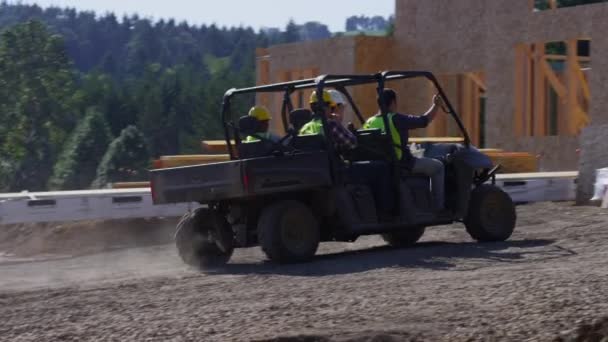 Workers driving utility vehicle — Stock Video
