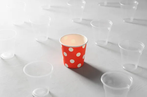 Eco Friendly Red Paper Cup Surrounded Plastic Cups Gray Table — Stock Photo, Image