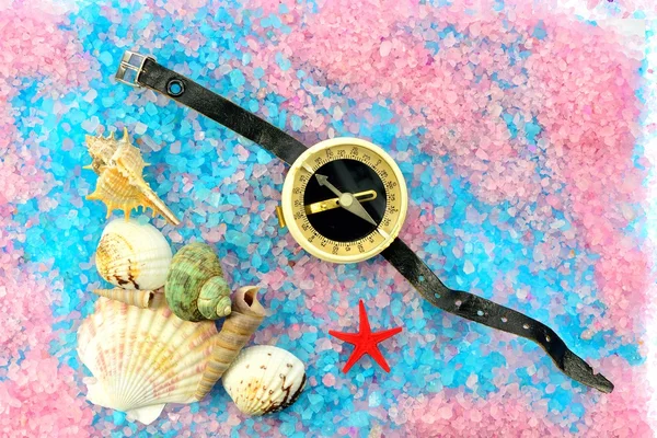 Shells, star and tourist compass on sea salt — Stock Photo, Image