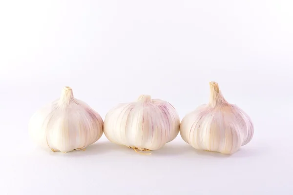 Three heads of garlic — Stock Photo, Image