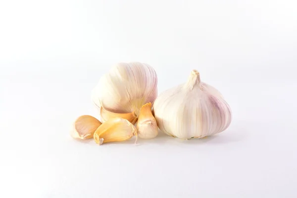 Cloves of garlic on a white background — Stock Photo, Image