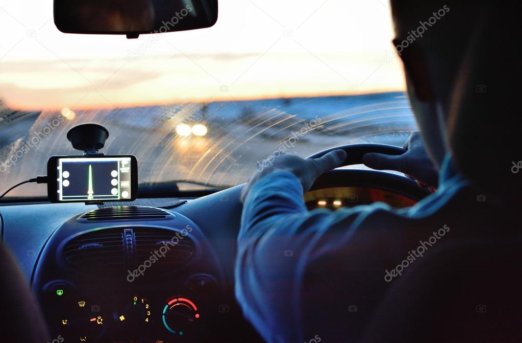 A man riding in a car