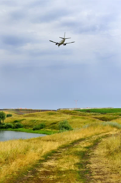 Plane over the river — Stock Photo, Image