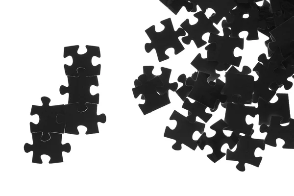 Черная головоломка на белом фоне — стоковое фото
