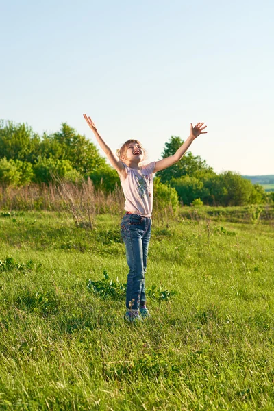 Girl playing frisbee in the park Stock Image