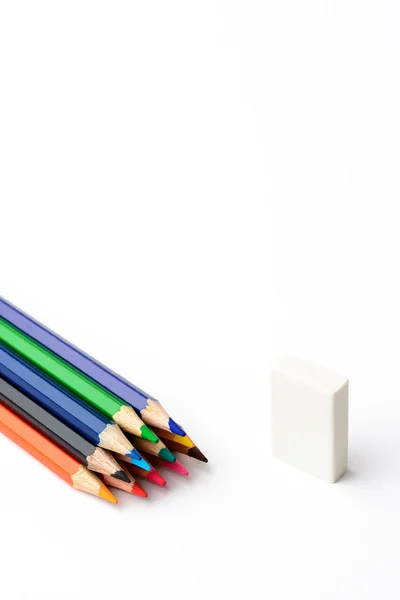 Colored pencils on a white piece of paper — Stock Photo, Image