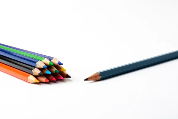 Colored pencils on a white piece of paper — Stock Photo, Image