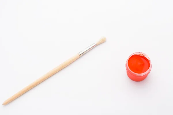 Paint in jars and brush — Stock Photo, Image