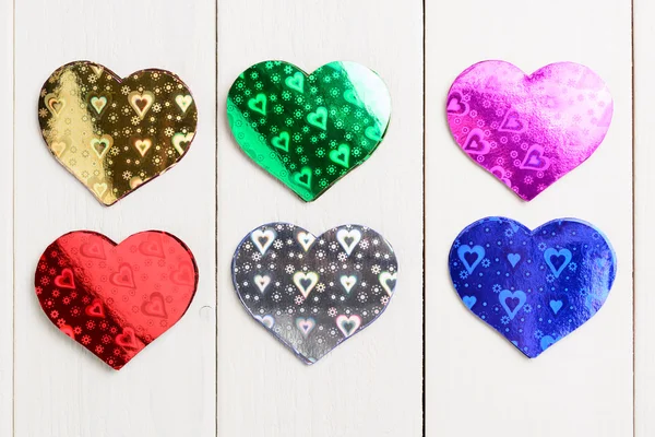 Figuras de papel de color en forma de corazón — Foto de Stock