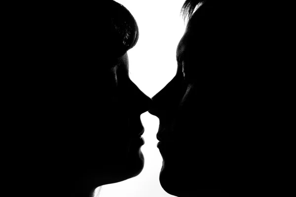 Black and white silhouettes of couples in love — Stock Photo, Image