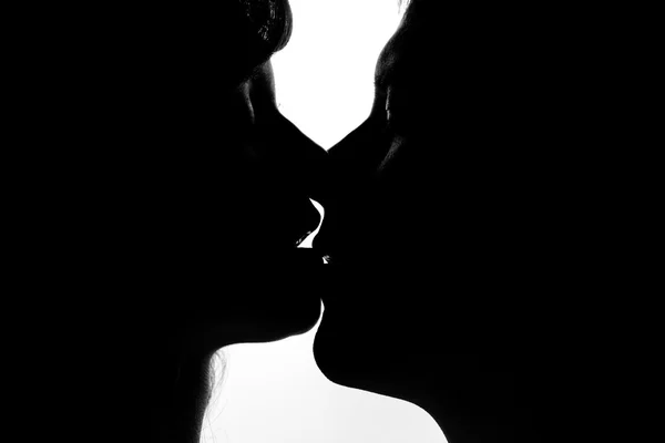 Black and white silhouettes of couples in love — Stock Photo, Image