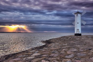 Lighthouse windmill Stawa Mlyny, Swinoujscie, Baltic Sea, Poland. clipart