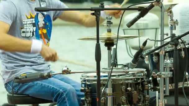 Drummer playing at a concert near the river — Stock Video