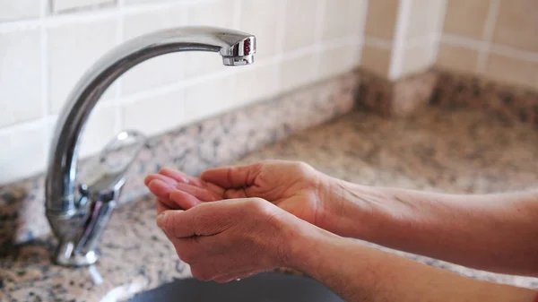 Water shortage.Fountain and middle-aged woman\'s hands.Affected of global warming made climate change. Drought concept.