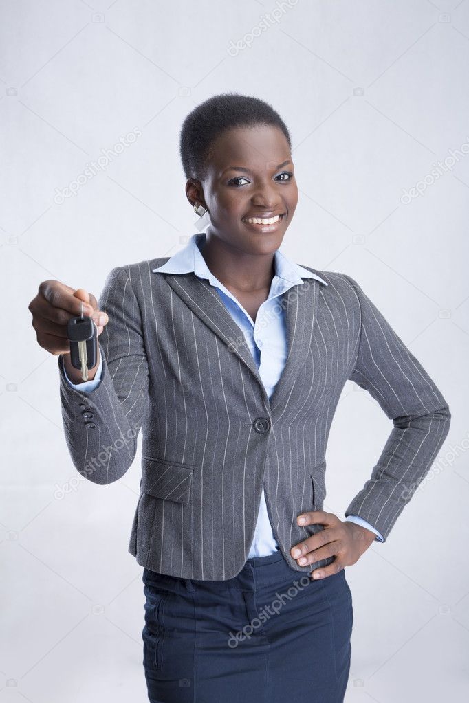 Business woman with kay in hand