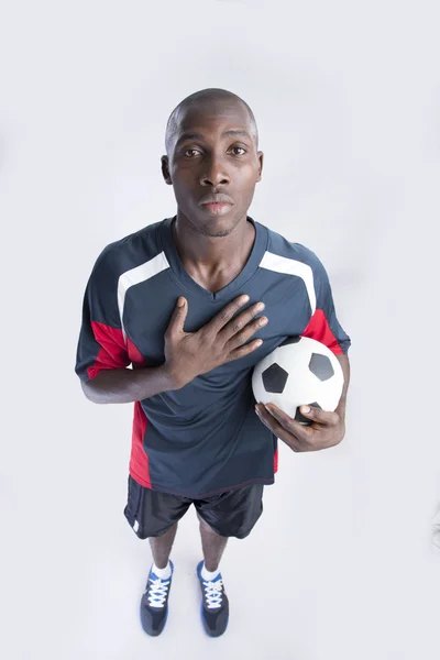 Athlete holding a football — Stock Photo, Image