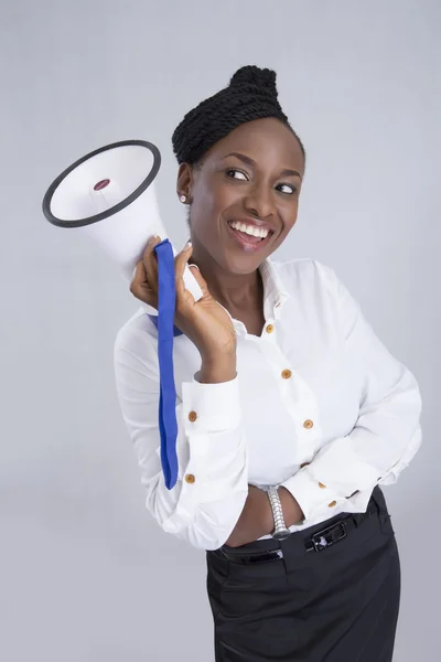 Businesswoman screaming into megaphone — Stock Photo, Image