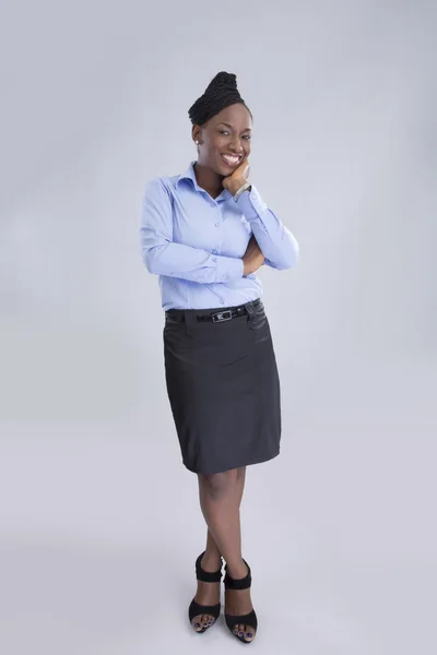 Businesswoman posing on gray background — Stock Photo, Image