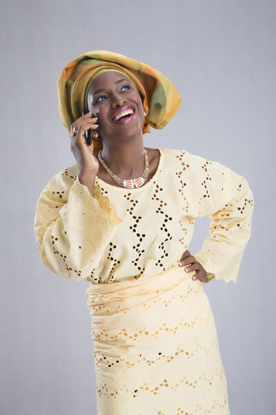 Woman speaking phone and smiling isolated