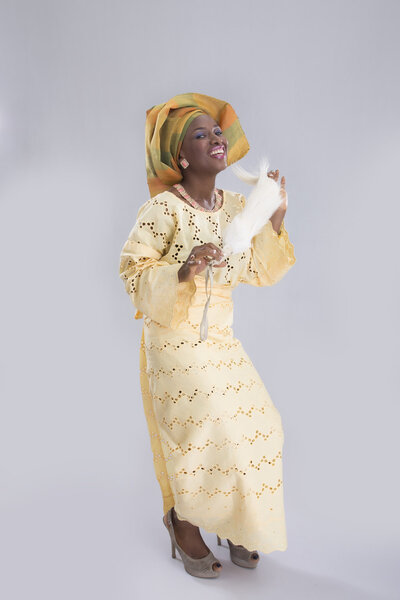 Woman sits on chair  and smiling