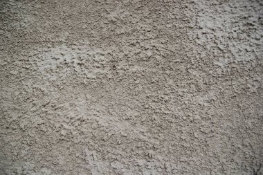 Gri bir duvara yakın plan. soyut sıva ile eski desenli arkaplan.