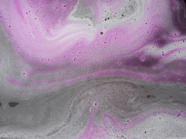 Beautiful pink and magenta soap background with waves and foam