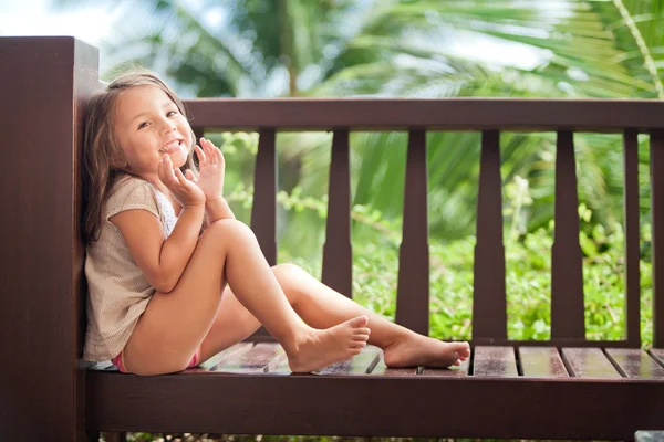 Happy little girl with dark hair — Stock Photo, Image