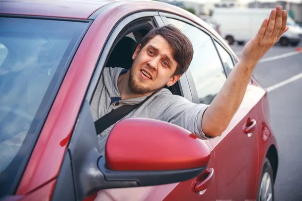 A young man in a road jam — Stock Photo, Image