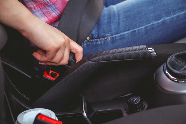 Young beautiful woman driving a car seat belt — Stock Photo, Image