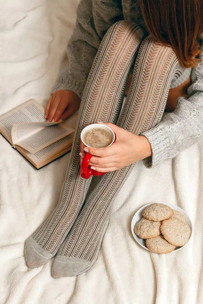 Young Woman Sweater Stockings Biscuits Red Coffee Cup Hands Relaxing — Stock Photo, Image