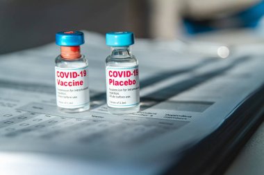 Covid 19 vaccine and placebo clinical trials and a medical records